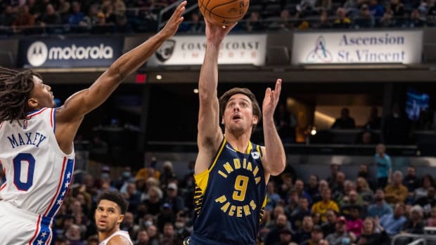 T.J. McConnell shots a floater as 76ers' Tyrese Maxey challenges.